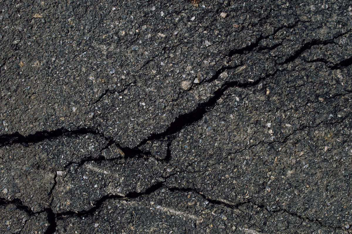 Repairing Cracks in Parking Lot Surfaces